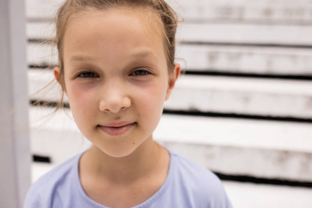 Portrait of Caucasian little girl, with contented emotion outdoor