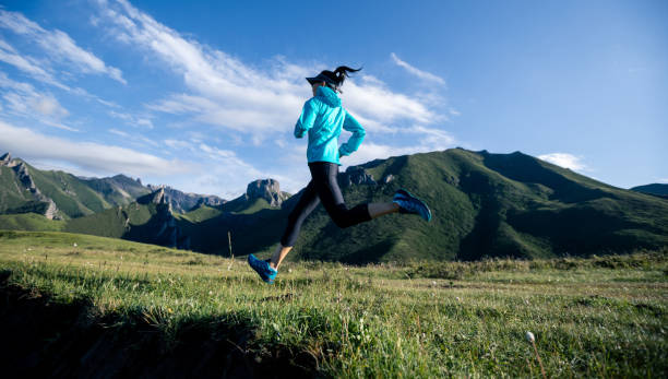 istock Young woman ultramarathon runner running at mountain top 1404382773