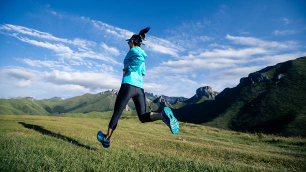 istock Young woman ultramarathon runner running at mountain top 1404382793