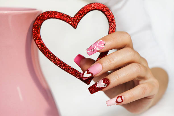 istock Pink multicolored manicure on long nails . 1404383879