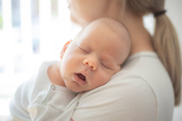 istock Unrecognizable mom with a newborn boy. 1404384472