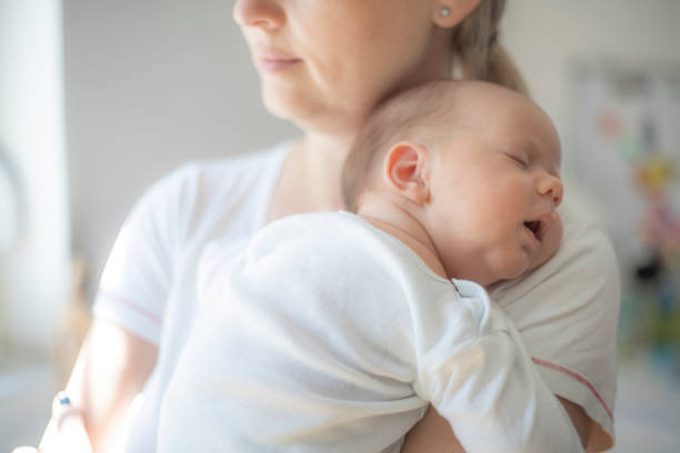 istock Mother embracing her 1 month old baby boy 1404384482