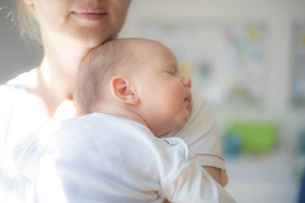 istock Mother embracing her 1 month old baby boy 1404384512