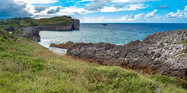 istock Grass Meadows and Cliffs, Buelna, Asturias, Spain 1404384950