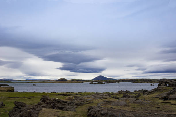 istock A lake surrounded by rocks and volcano crater 1404386571
