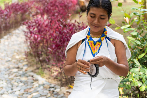 istock indigenous woman making traditional weaving. 1404388469