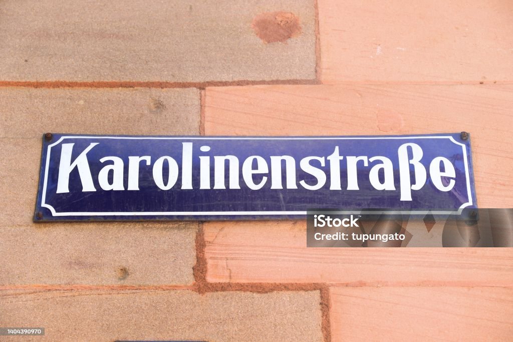 Karolinenstrasse in Nuremberg, Germany Nuremberg city, Germany. Sign with street name - Karolinenstrasse. Street Name Sign Stock Photo