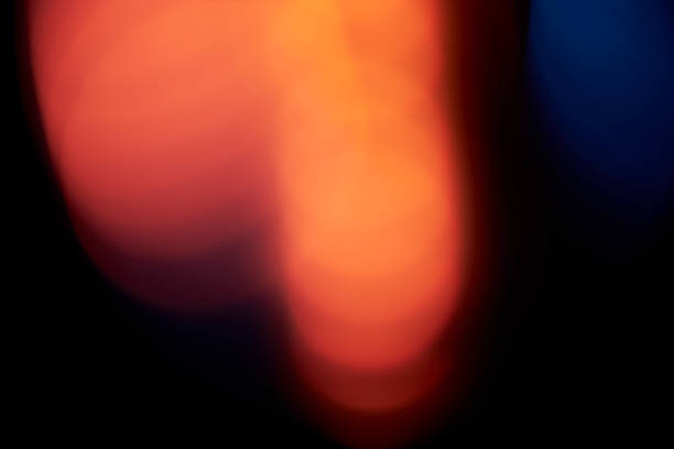 Abstract defocused lens light leak on black background