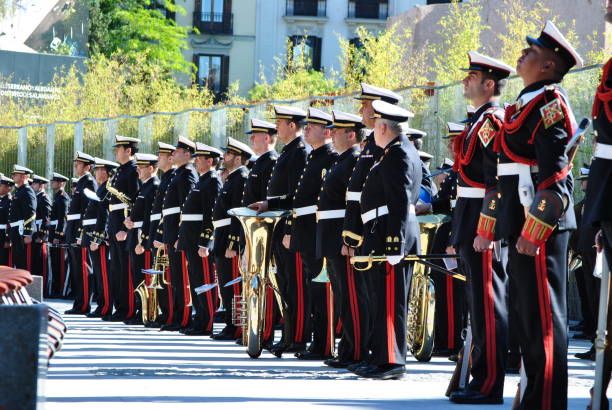 Lisbon, Portugal - June 12, 2023: Band musicians dressed in traditional folklore costumes, prepare to parade in Lisbon downtown, during this city celebrations of the Popular Saints.