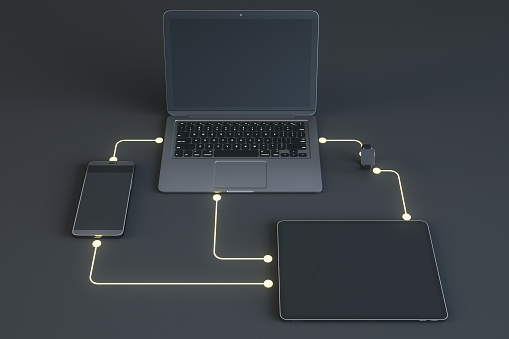 Cloud data exchange and wireless connection concept with modern gadgets, digital tablet, laptop, smartphone and smart watch connected by digital lines on dark background. 3D rendering