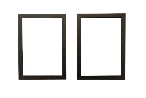 istock Two natural photo frames with blank space hanging on a wall, isolated on white 1404398663