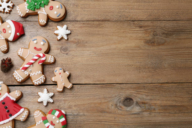 istock Delicious Christmas cookies on wooden table, flat lay. Space for text 1404399253
