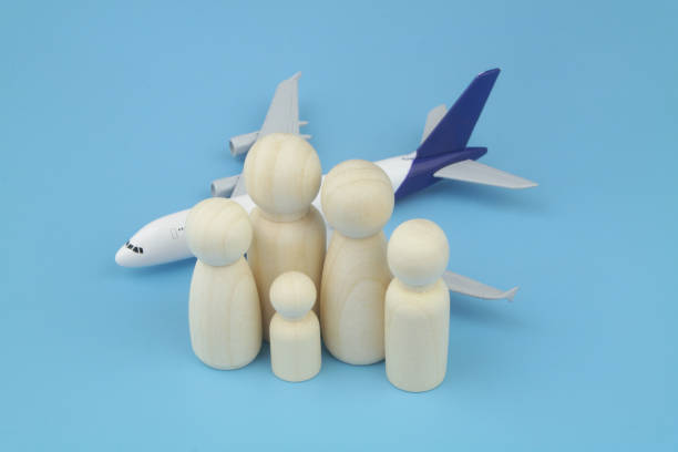 istock Family people figures and airplane on blue background. 1404399855