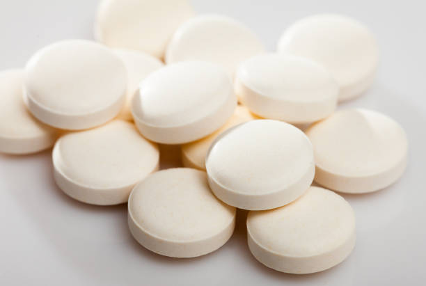 istock Heap of identical pills 1404399903