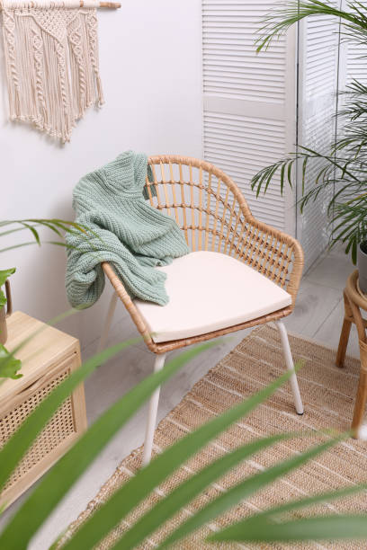 istock Stylish room interior with beautiful potted plants and comfortable chair 1404404375