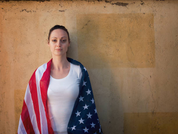 istock Female with American flag 1404406359