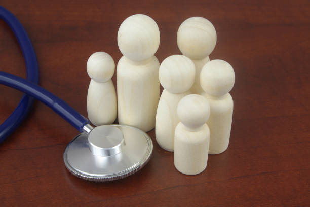 istock Family people figures with stethoscope. 1404407487