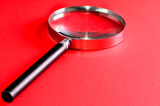 Vintage Magnify Glass Loupe on a Colored Background