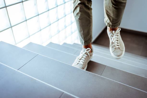 Businessman ascending office stairs Every step will bring you closer to great success steps stock pictures, royalty-free photos & images