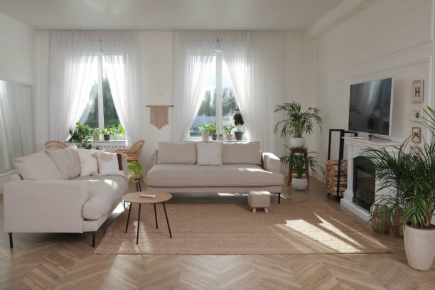 istock Stylish living room with comfortable sofas, modern TV and fireplace. Interior design 1404408790