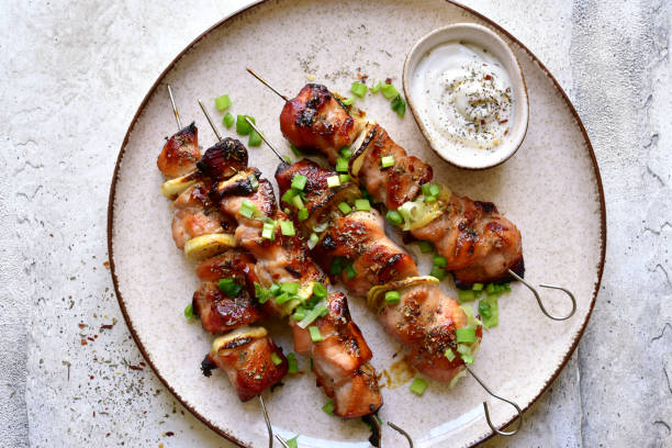 istock Roasted chicken kebab or souvlaki. Top view with copy space. 1404408796