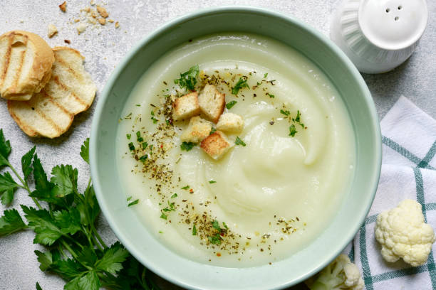 istock Vegetarian cauliflower cream soup with croutons. Top view with copy space. 1404409103