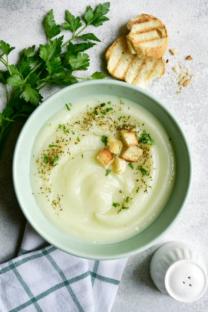 istock Vegetarian cauliflower cream soup with croutons. Top view with copy space. 1404409104
