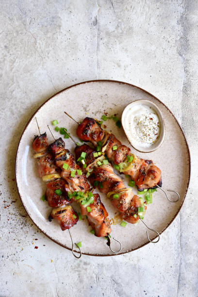 istock Roasted chicken kebab or souvlaki. Top view with copy space. 1404409106