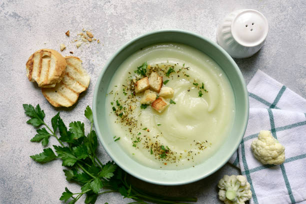 istock Vegetarian cauliflower cream soup with croutons. Top view with copy space. 1404409209