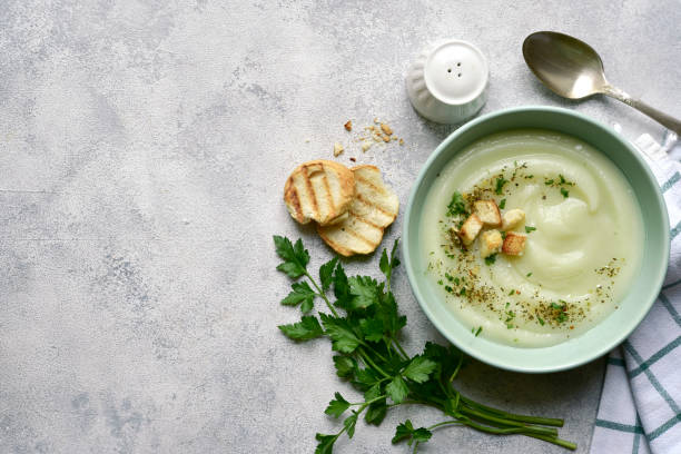 istock Vegetarian cauliflower cream soup with croutons. Top view with copy space. 1404409217