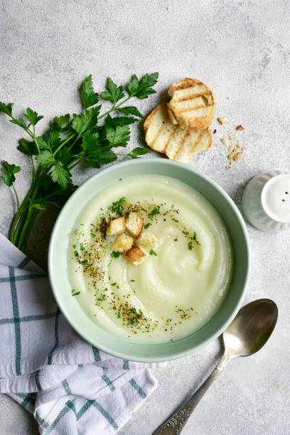 istock Vegetarian cauliflower cream soup with croutons. Top view with copy space. 1404409261