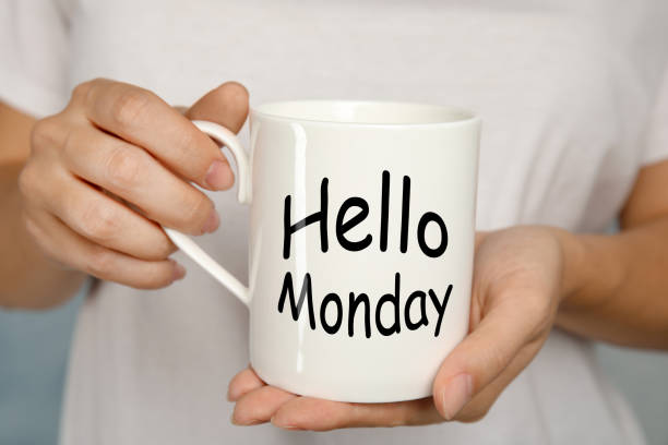 istock Start your week with good mood. Woman holding ceramic cup with text Hellow Monday, closeup 1404412273