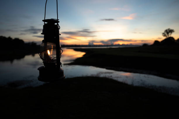 istock Ancient lantern in the dark, View of river with reflections. 1404415060