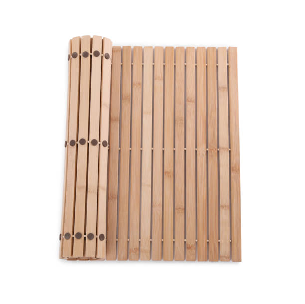 istock Bamboo rug isolated on white, top view. Bath accessory 1404416269