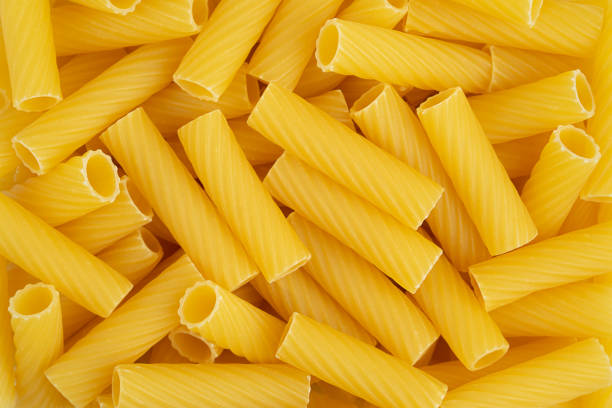 istock Italian pasta tortiglioni background. Top view. 1404417705