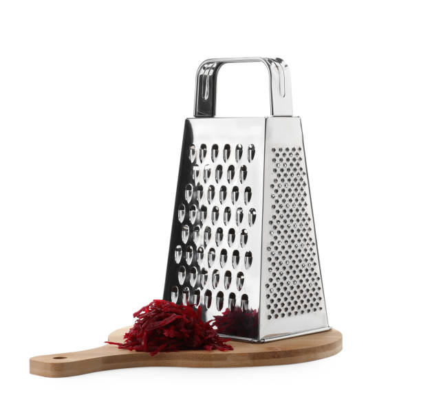 Stainless steel grater and fresh beetroot on white background