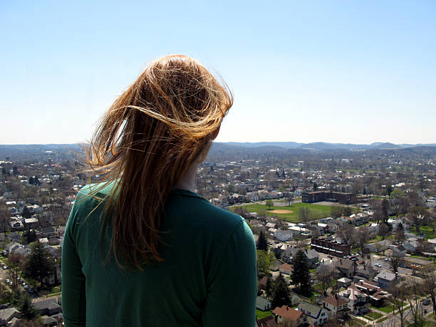 Girl over looking city stock photo