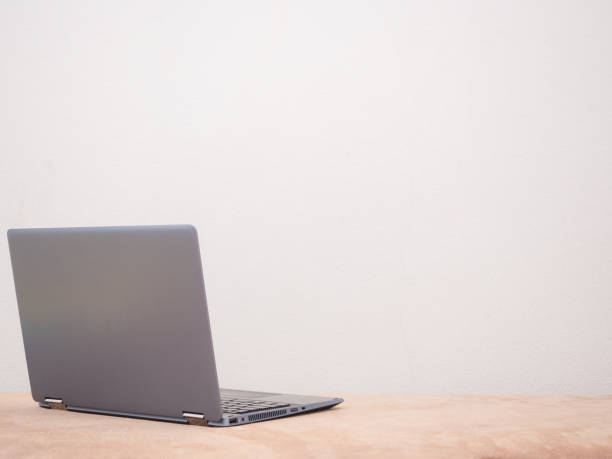 istock Laptop on sofa silver color on white background copy space concept 1404424552