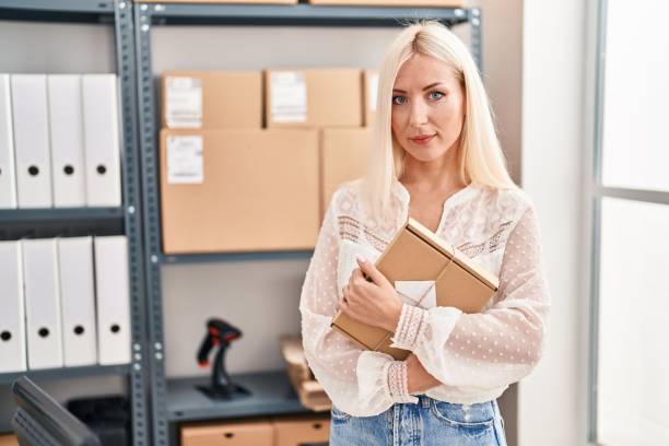 istock Caucasian woman working at small business ecommerce relaxed with serious expression on face. simple and natural looking at the camera. 1404425409