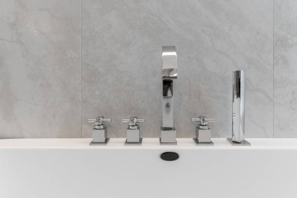 istock Metal faucet for white bathtub 1404425852