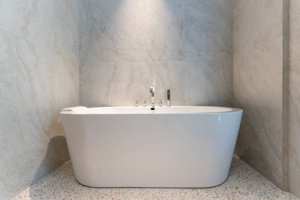 istock Bright white bathtub in bathroom 1404426008