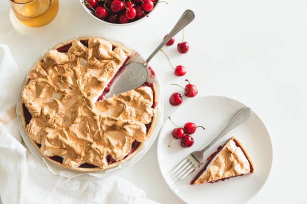 Plate with tasty cherry pie on white background. Top view. Copy space