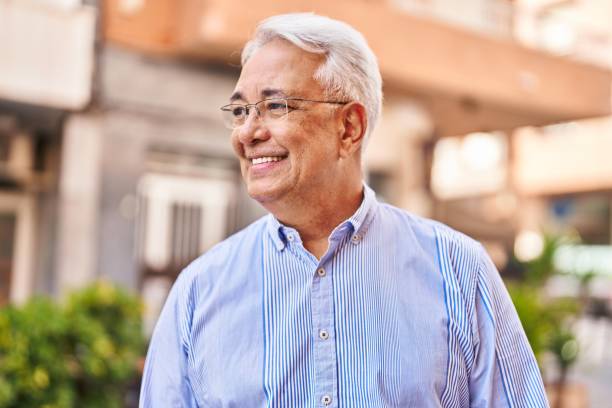istock Senior man smiling confident standing at street 1404426669