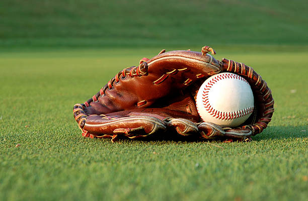 istock Baseball glove on the field 140442734