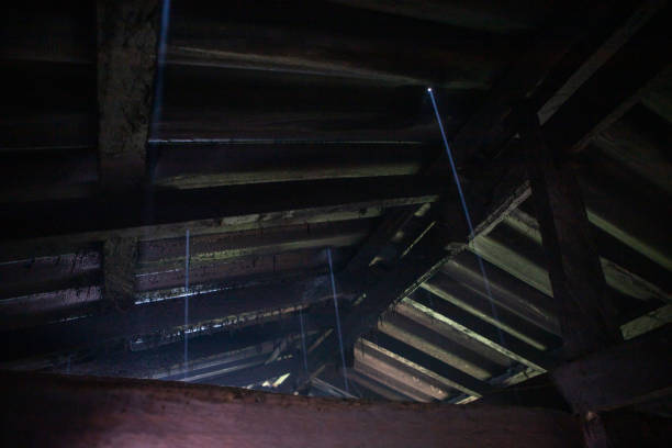 istock The roof is leaking holes, allowing light to pass through. 1404429105