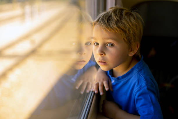 istock Cute little child, boy, traveling on a train 1404429897