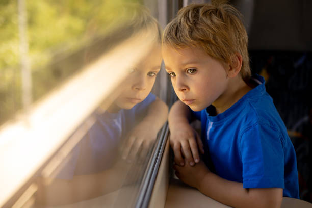 istock Cute little child, boy, traveling on a train 1404430337