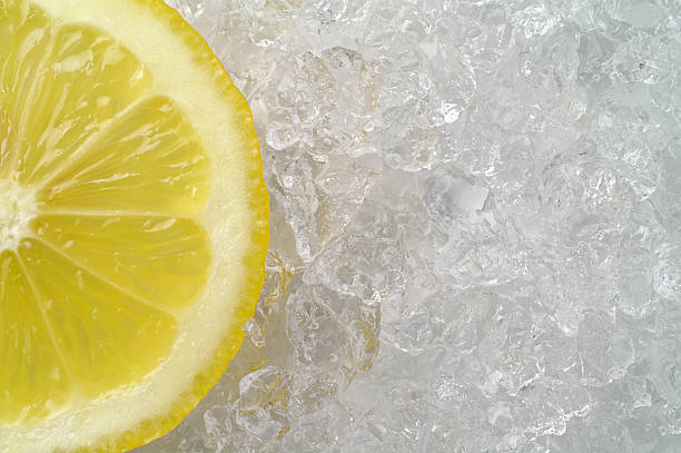 Lemon slice on crushed ice (1) stock photo
