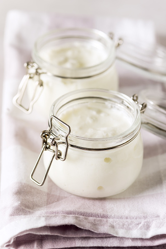 Yogurt in Glass Jar on Linen Napkin White Yoghurt Tasty and Healthy Breakfast Vertical