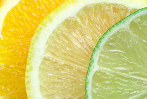 Slices of orange, lemon and lime close-up. Macro photo.